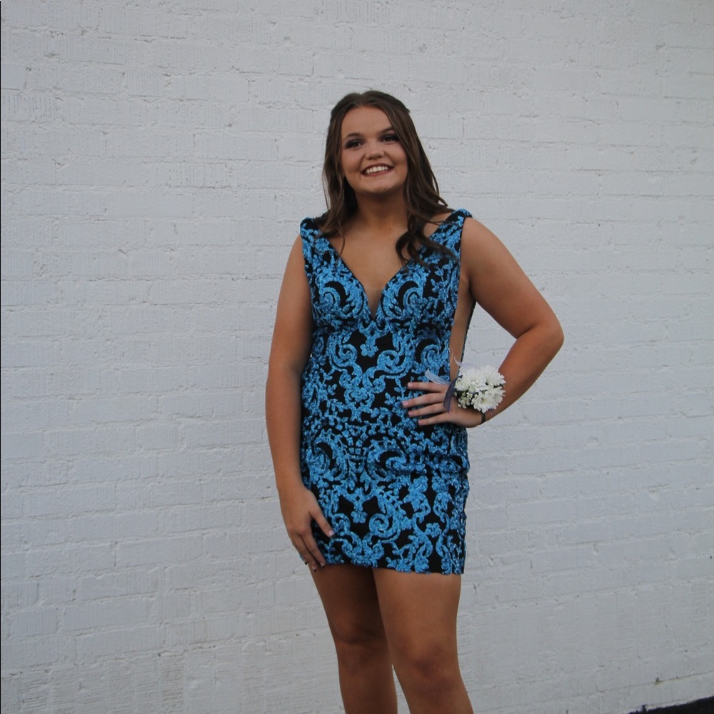 i am selling a sparkly blue tight homecoming dress. it is a ava presley size 14.